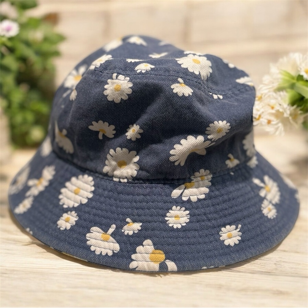 Dusty blue bucket hat with white floral daisy pattern